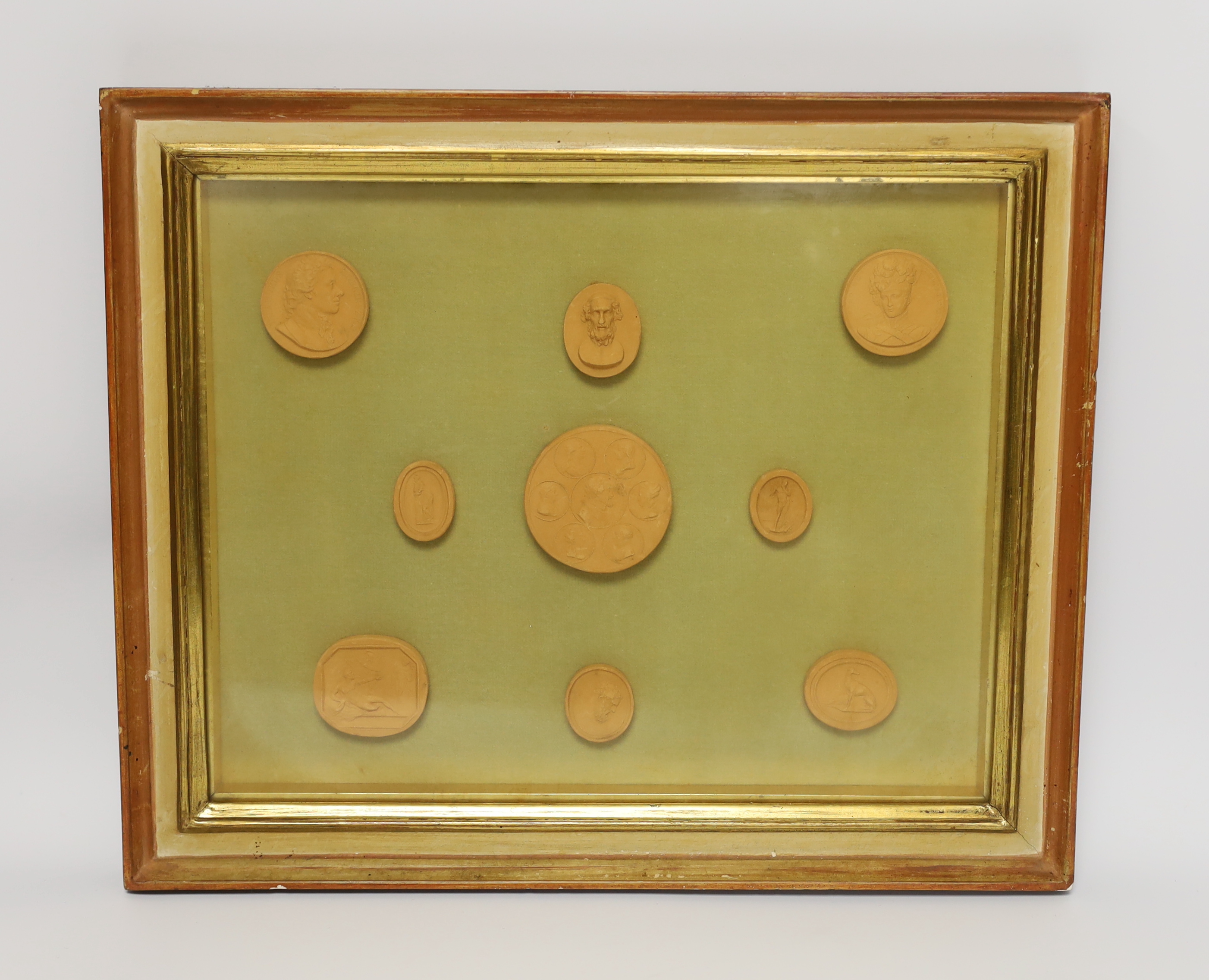 A framed set of nine grand tour medallions, 30x37cm total